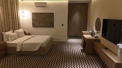 Cama o camas de una habitación en Elysian Hotels Abuja