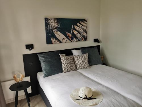 Postel nebo postele na pokoji v ubytování Vakantiepark de Zeeuwse Parel - De Witte Parel