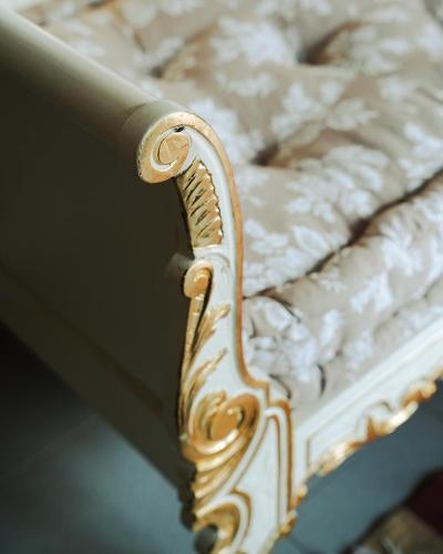 a close up of a white and gold bed frame at DAR EL HAMRA in Mahdia