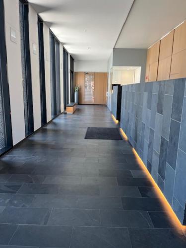 a hallway of an office building with a long hallway at "VH apartment" - center of Antwerp - free parking in Antwerp