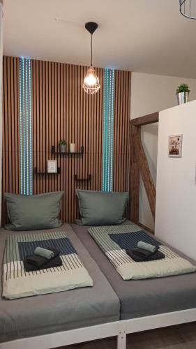 two beds sitting next to each other in a room at Apartment Tiny Style in Vohenstrauß