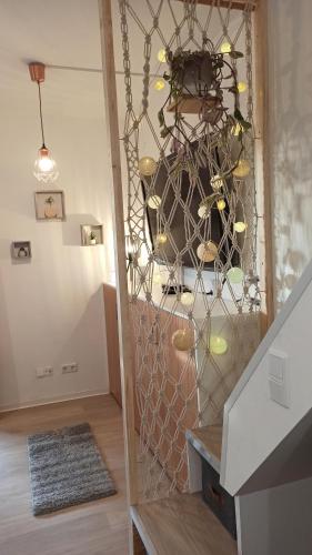 a room with a glass wall with a potted plant at Apartment Tiny Style in Vohenstrauß