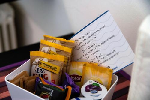 a box filled with snacks and a note at Beyond Como by Quokka 360 - flat 10 minutes from the centre of Como in Lipomo
