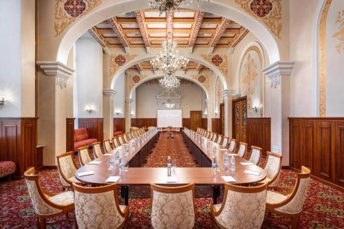 a large conference room with a long table and chairs at Natsionalny Hotel in Kyiv