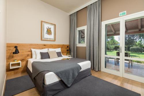 Ένα ή περισσότερα κρεβάτια σε δωμάτιο στο Rooms Alla Beccaccia