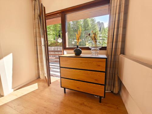 a dresser in a room with a window at Ski View - CieloAlto Cervinia in Breuil-Cervinia