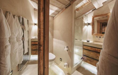 a bathroom with a shower and a toilet at Winter Deluxe Chalet Megève in Megève