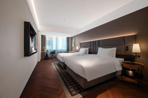 Cama o camas de una habitación en 深圳南山万科云城城际酒店