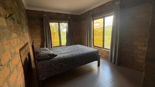 a bedroom with a bed and a large window at Shiwa riverside apartment 