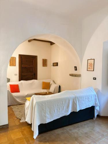 a bedroom with two beds in a room at Convento del Carmine 4 in Fivizzano