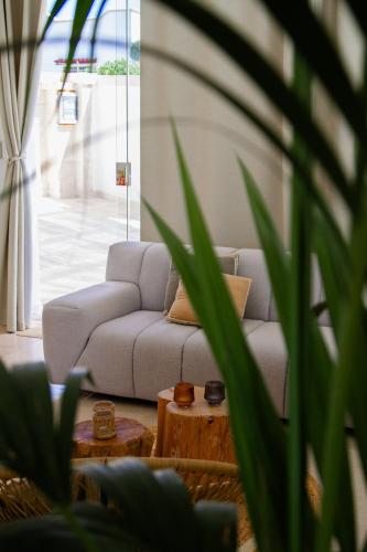 a living room with a couch and a table at Villa Gufo in Ostuni