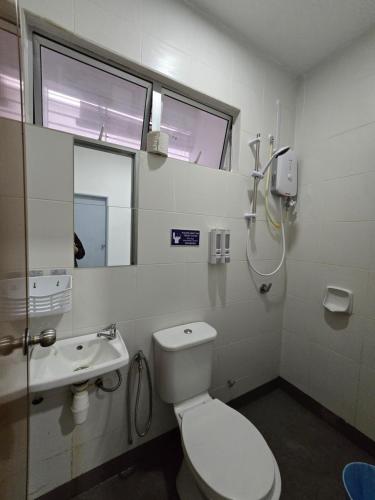 a bathroom with a toilet and a shower and a sink at Homestay D'Casa, Apartment In Sepang, KLIA in Sepang
