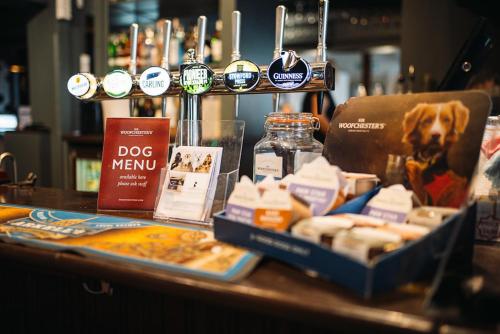 a table with cheese and other products on a counter at The Rose & Crown, Ashbury in Ashbury