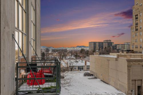 a view of a city with snow and buildings at Stylish City Loft Walk To Dining & Shops in Denver