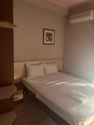 a bedroom with a large white bed in a room at Boutique Hotel Taste Tbilisi in Tbilisi City