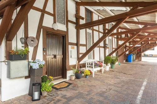a hallway with potted plants and a door in a building at Ferienwohnung Beti in Korbach