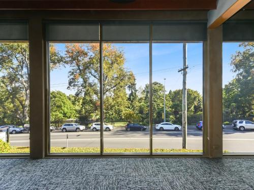 a view from the inside of a building with windows at Commodore Regent Launceston in Launceston