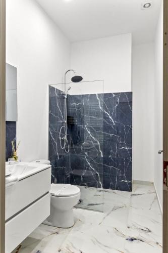 a bathroom with a toilet and a sink at Selari Boutique in Bucharest