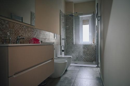 a bathroom with a toilet and a sink and a shower at Room in Rome in Rome
