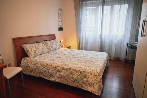 a bedroom with a bed and a window at Room in Rome in Rome