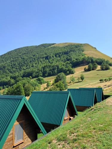 an overhead view of a row of houses on a hill at Kamp Kruščić - Laništa in Mojkovac