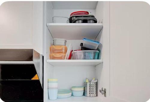 an open kitchen drawer with food and utensils at Downsview Park Townhome queen bed near Yorkdale Transit in Toronto