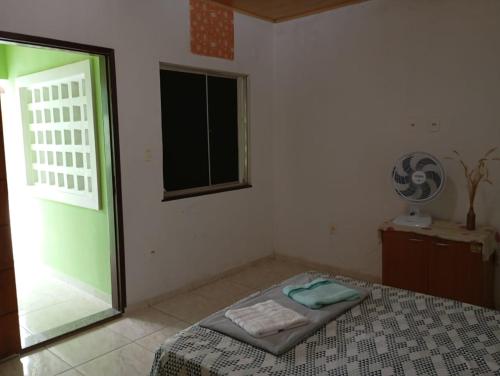 Ένα ή περισσότερα κρεβάτια σε δωμάτιο στο hospedagem próxima ao centro apto luxo