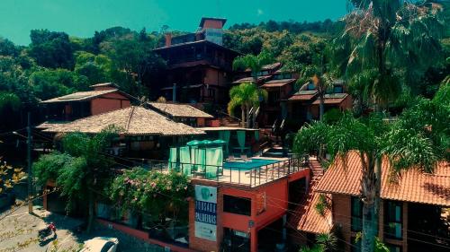 an overhead view of a village with houses and trees at Pousada Palmeiras Bombinhas in Bombinhas