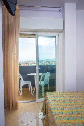 Postel nebo postele na pokoji v ubytování Hotel Palace Magnolia SPA