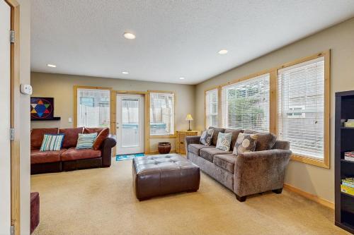 a living room with two couches and a couch at Neskowin Treehouse in Neskowin
