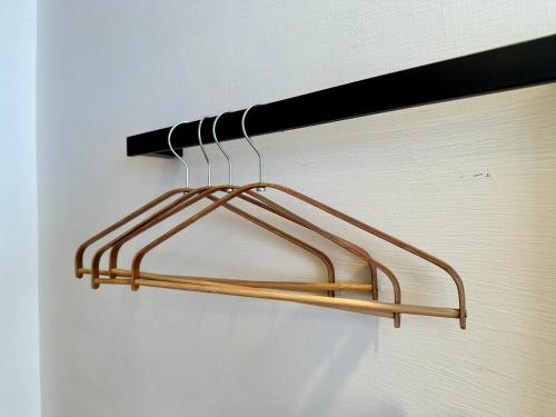 a metal towel rack hanging on a wall at 日月慢遊 in Yuchi