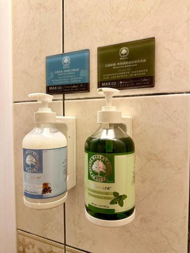 two bottles of cleaning products on a wall at 日月慢遊 in Yuchi