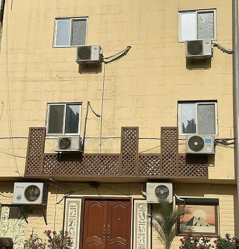 a building with speakers on the side of it at Kemet Aurora Pyramds View in Cairo