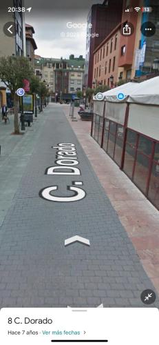 a street with the number five written on the sidewalk at Esther in Langreo