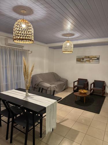 a living room with a table and a couch at Hermoso Depto en ELDORADO in Eldorado