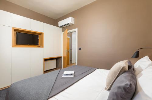 Ένα ή περισσότερα κρεβάτια σε δωμάτιο στο Rooms Alla Beccaccia