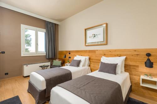 Ένα ή περισσότερα κρεβάτια σε δωμάτιο στο Rooms Alla Beccaccia