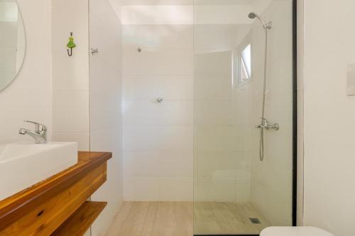 a bathroom with a shower and a sink at The Lodge Chacras in Ciudad Lujan de Cuyo