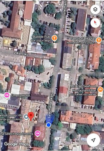 a map of a street with buildings and signs at Shesh Center Hostel in Pristina