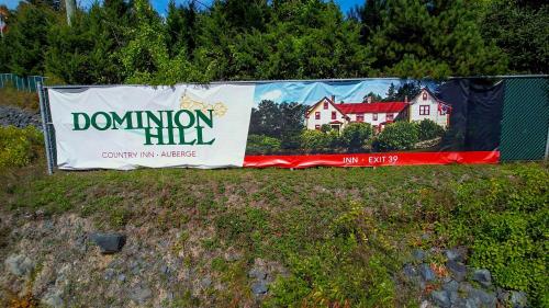 a donation hill banner hanging on a fence at Dominion Hill Country Inn in Bocabec