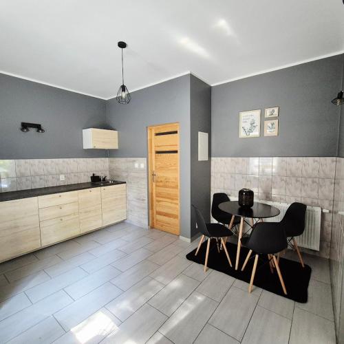 Η κουζίνα ή μικρή κουζίνα στο Szkocka 4 Apartamenty
