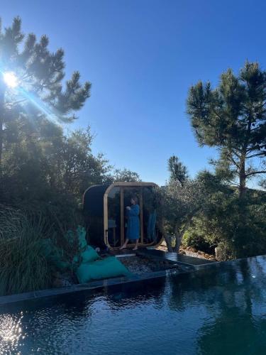 a couple of people standing on a roller coaster by a water slide at Eco-lodge Villa Epicurea in Sesimbra