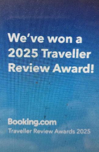 a sign that says weve won a traveler review award at Pousada Onda de Mar in Angra dos Reis