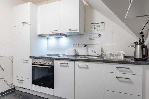 Una cocina o cocineta en MK Hostel Oyten - free Wifi & Parking - 24h Check-In
