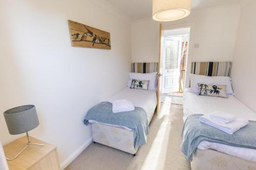 Ένα ή περισσότερα κρεβάτια σε δωμάτιο στο The Whiteacres Lodge