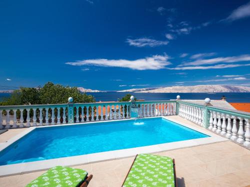 a swimming pool on the balcony of a house at Apartment in Senj near the Sea & Pool in Senj