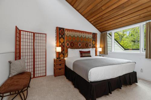 a bedroom with a large bed and a window at Ledges 72 with Wintergreen Advantage in Wintergreen