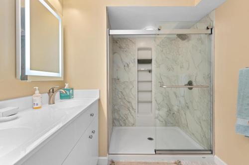 a white bathroom with a shower with a glass door at Shenandoah Ridge 05 with Wintergreen Advantage in Wintergreen