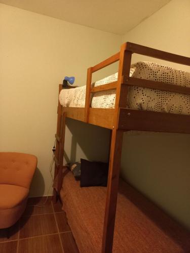 a room with two bunk beds in a room at Chácara with pool and trails in the Cerrado biome in São Carlos