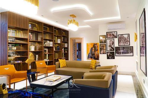 a living room with a couch and a table at Sujimoto Shortlet Ave Forche, Banana Island, Ikoyi in Ikoyi